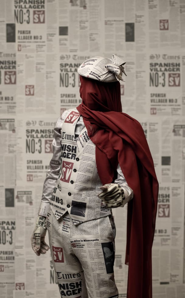 Ondara in a newsprint suit with red cape as his Spanish Villager character