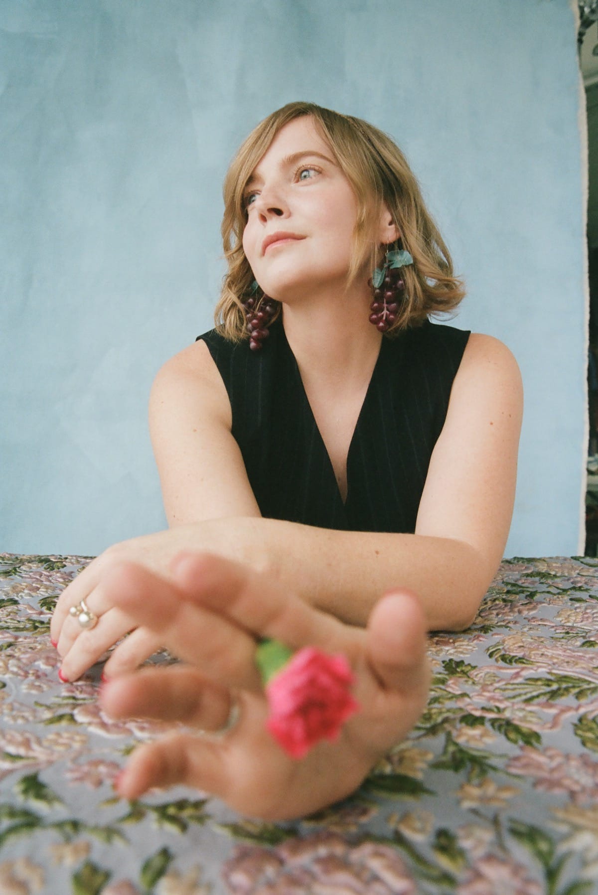 Courtney Marie Andrews holding a flower