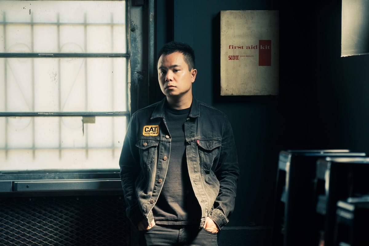 Gabe Lee stands in front of a window