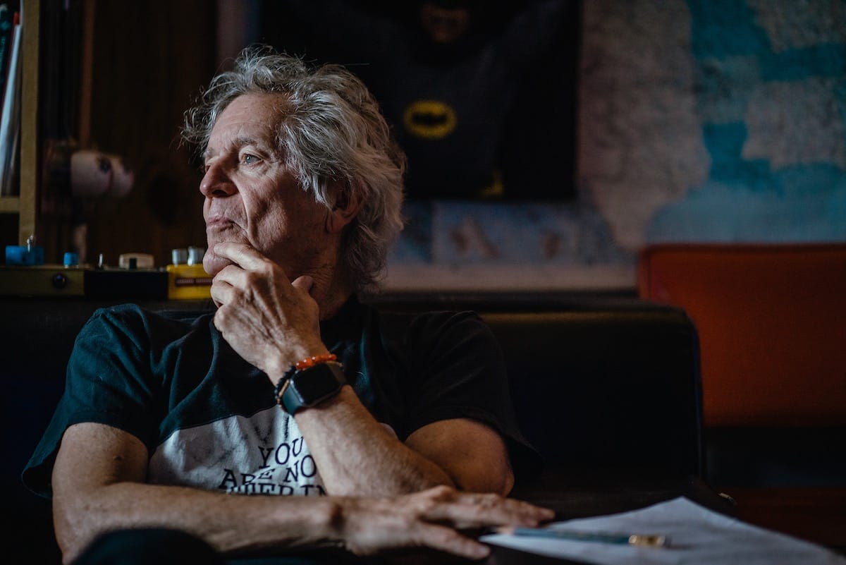 Rodney Crowell looks pensively out a window