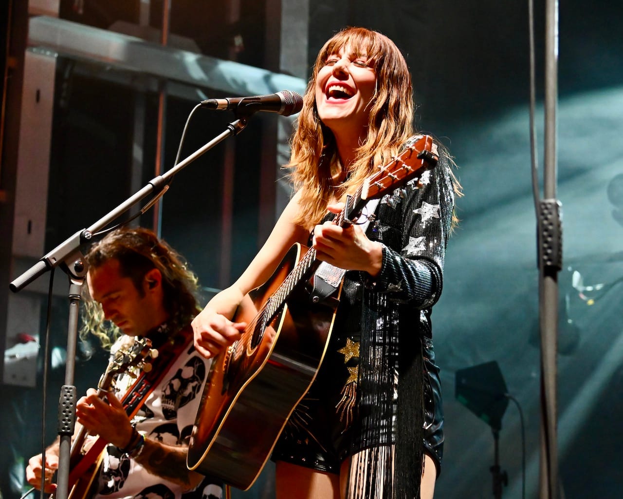 Molly Tuttle onstage playing guitar