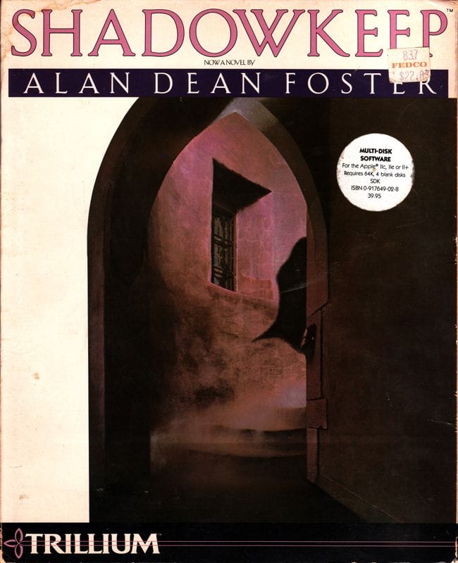 The cover of the game Shadowkeep, with very very tiny text reading "Now a novel by" Alan Dean Foster. The artwork shows a dark, misty stone corridor with a window casting dim light. A Trillium logo runs along the bottom, and a sticker notes it’s multi-disk software for the Apple II.