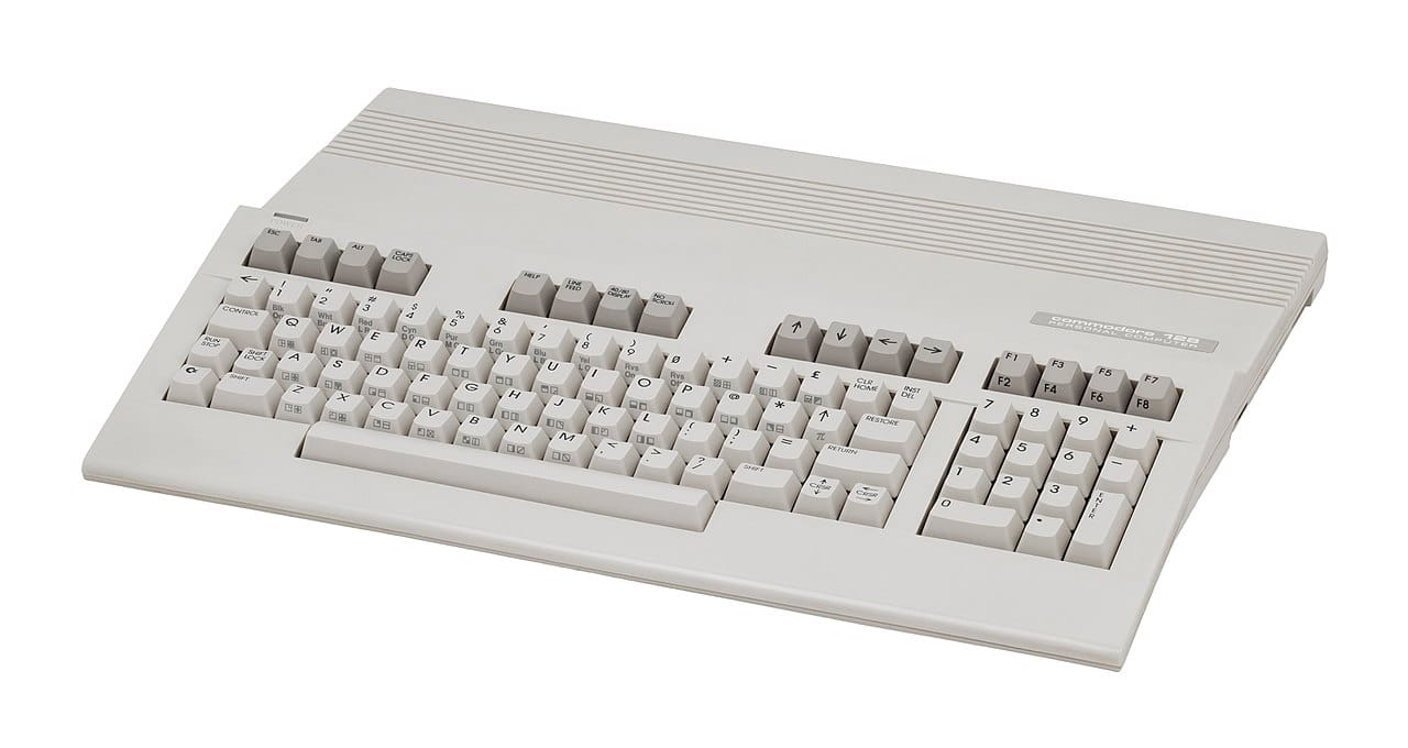 A commodore 128 in white, looking sleek. It sits in a white void.