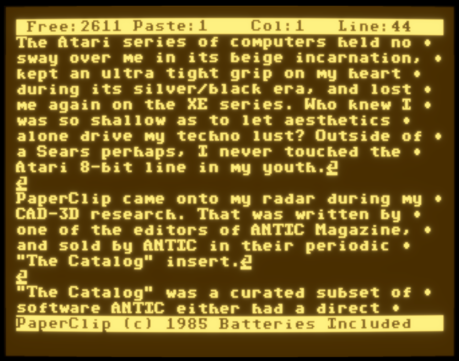 Screenshot of PaperClip on an Atari XE emulated under Altirra, showing a full-screen text editor with soft yellow text on a dark brown background, a chunky pixel font, and a simple status bar at the top. The interface feels warm and inviting.