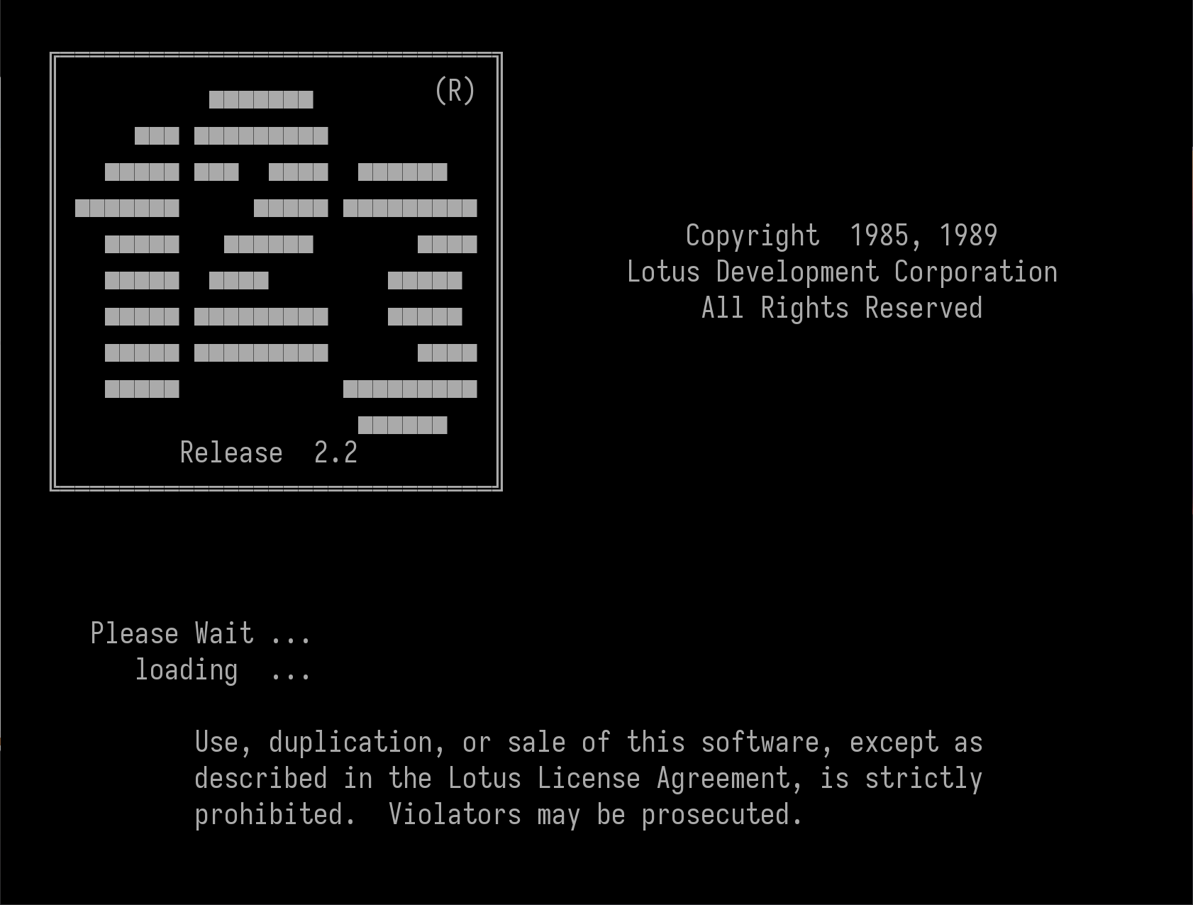 Splash screen of Lotus 1-2-3 Release 2.2. Black with white text, the 1-2-3 logo is rendered in ASCII graphics. Other text gives copyright info, loading status, and a stern warning about breaking the license agreement. Violators may be prosecuted. "May" it says? I'll take my chances!