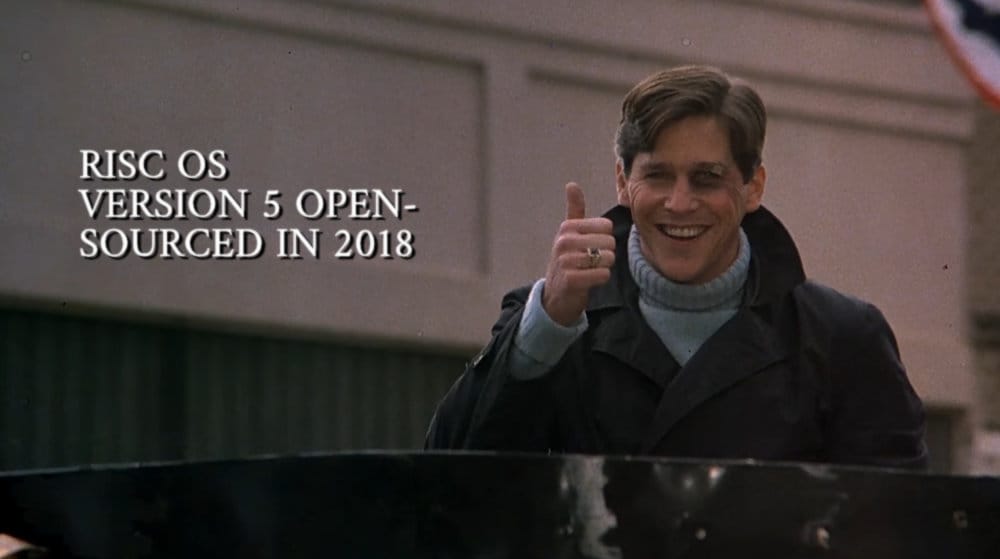 Tim Matheson giving a thumbs up at the end of Animal House. Caption reads, "RISC OS. Version 5 open-sourced in 2018"