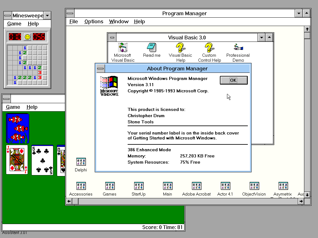 Screenshot of Windows 3.1, showing the Program Manager, Minesweeper, and Solitaire. The "About Program Manager" window is up to verify I am using Version 3.11, my memory is at 257,203 KB Free, and my system resources are 75% Free.