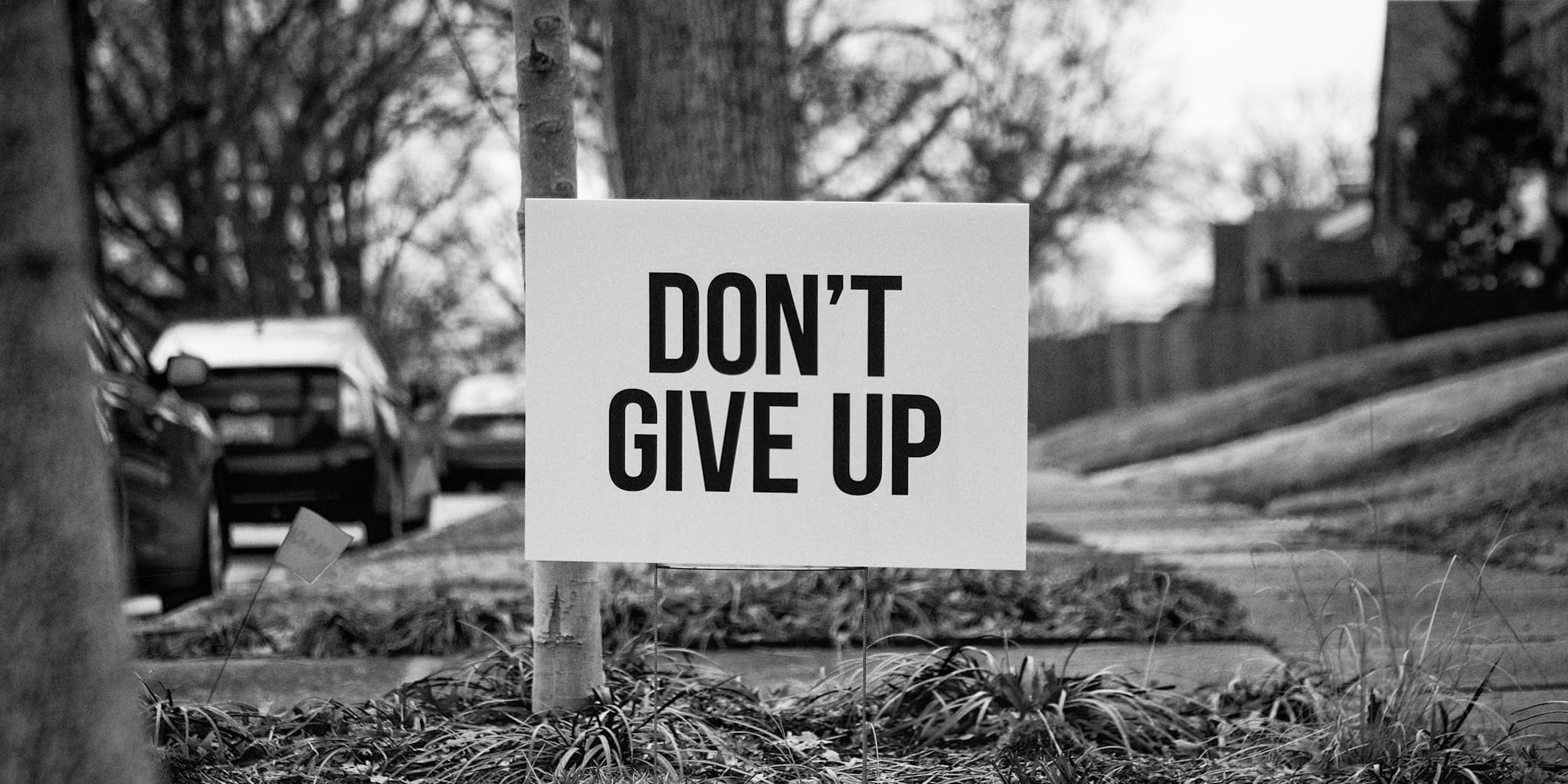 "Don't Give Up" sign
