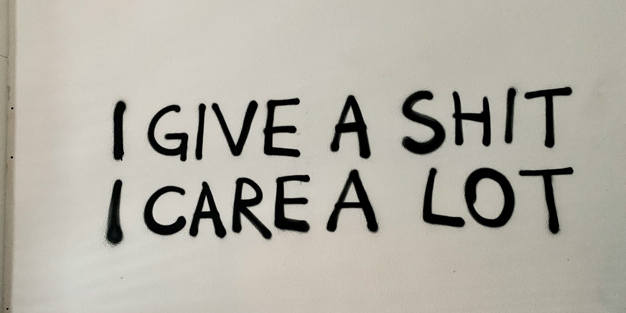 "I give a shit, I care a lot" graffiti