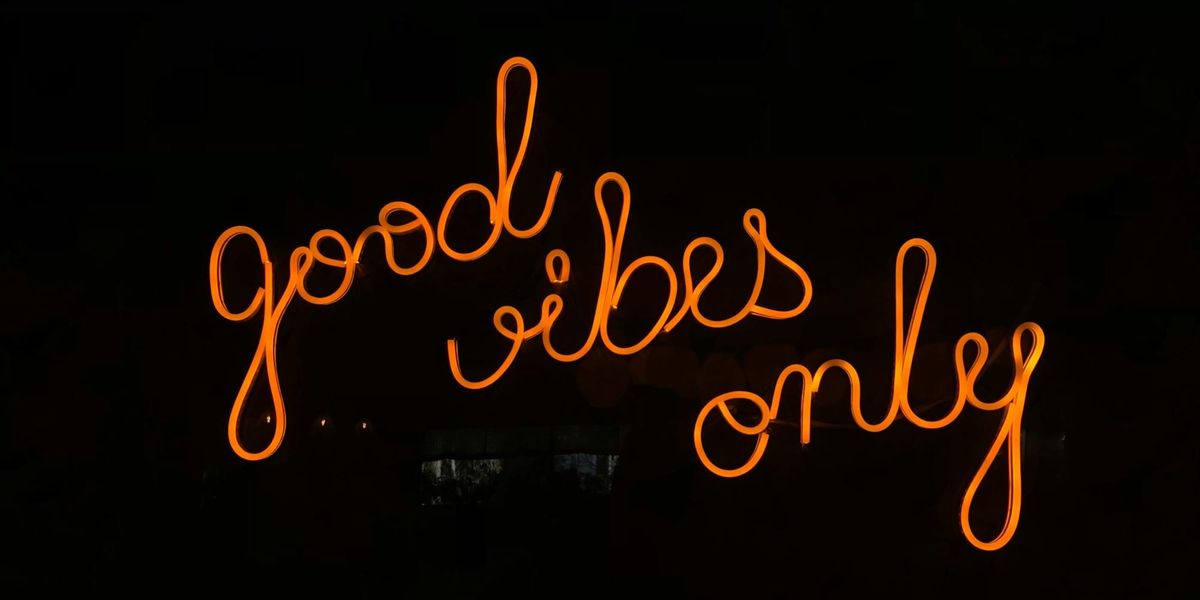 "Good Vibes Only" in neon letters