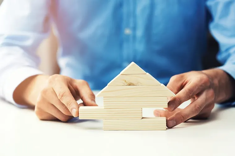 Stacking wooden blocks in a triang
