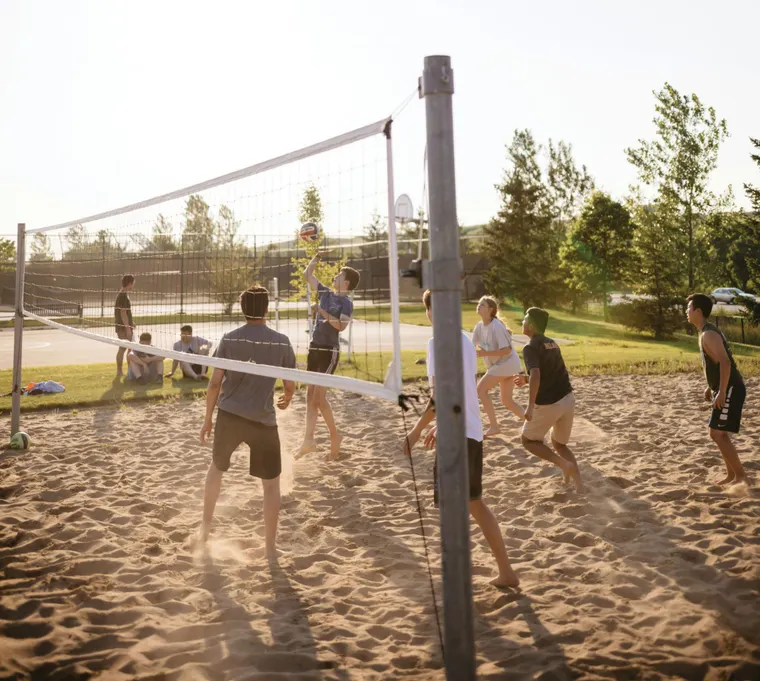 A game of sand volleyball with a group of friends