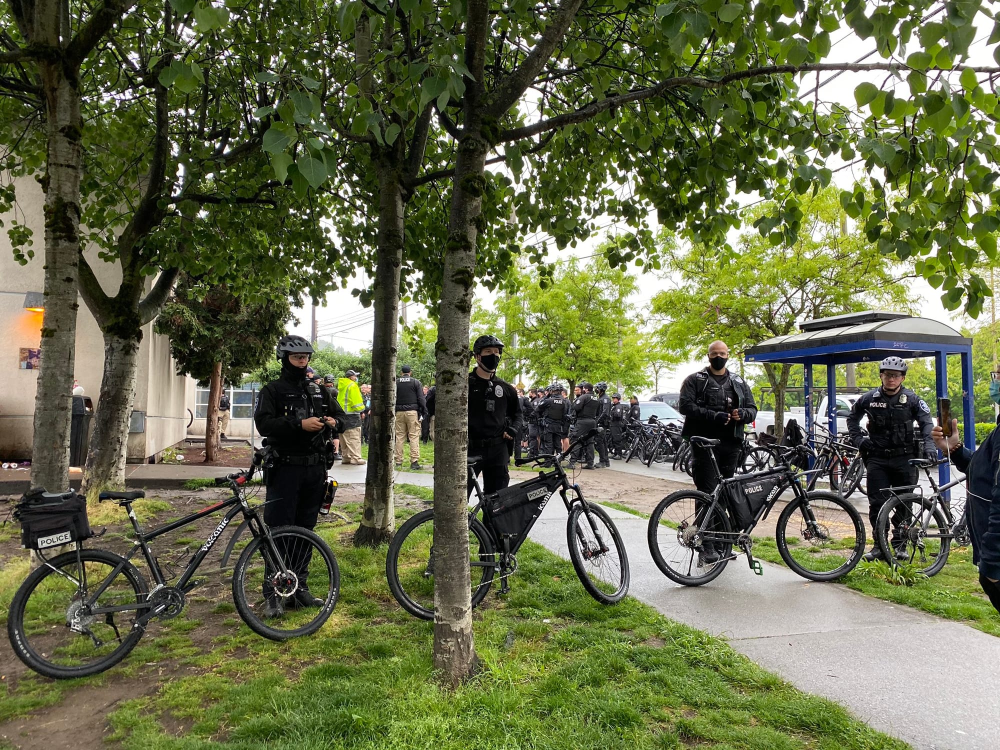 Police gathered in large numbers to ensure houseless were swept and cleared in rapid fashion with no interruption from encampment residents or their allies. (Photo by Enrico Doan)