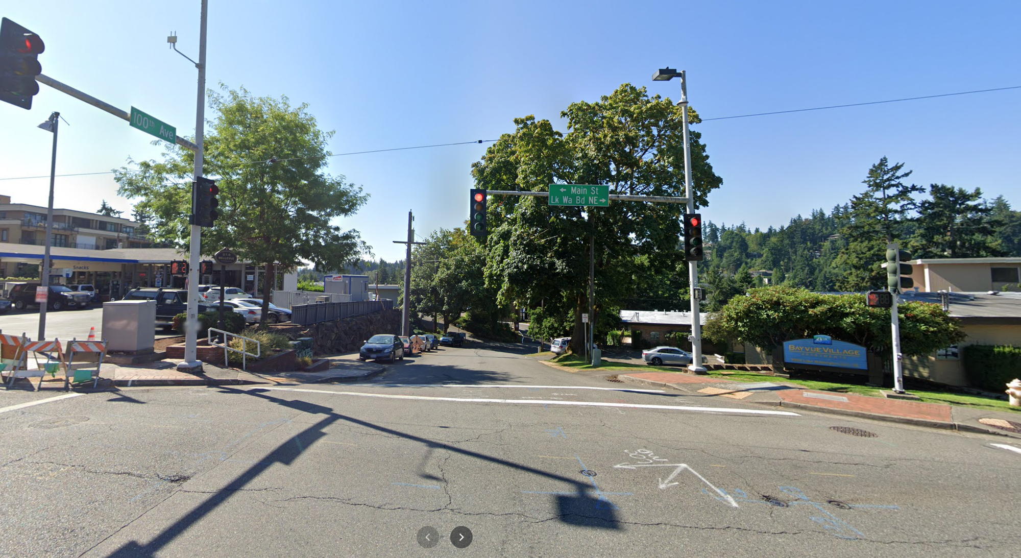 A photo of an intersection with traffic lights.
