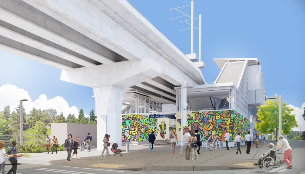 A view of the 130th Street light rail station from the south, with many people walking, biking or using wheelchairs to access transit