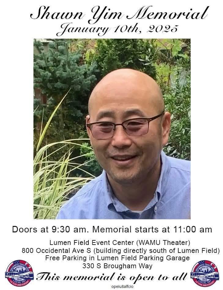 Shawn YIm is a middle-aged bald Asian man with glasses. He poses smiling in a garden.