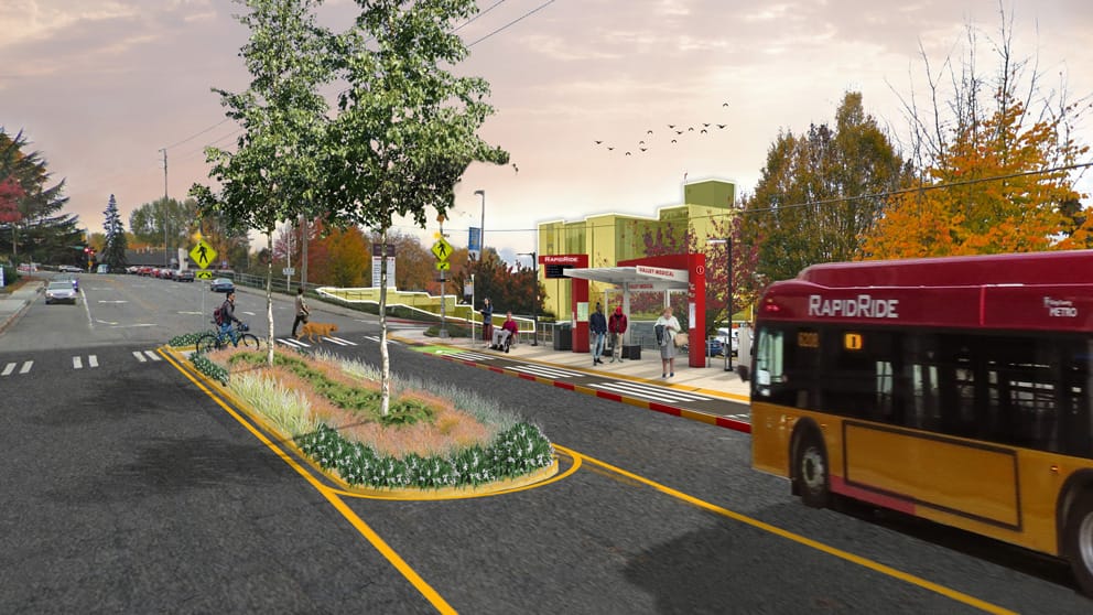 A rendering of a RapidRide bus arriving at a newly rebuilt bus stop with bus shelter and RapidRide pylon, with a median in the street adding trees and pedestrian safety. Riders wait under the shelter and two people use the cross walk, one walking a bike.