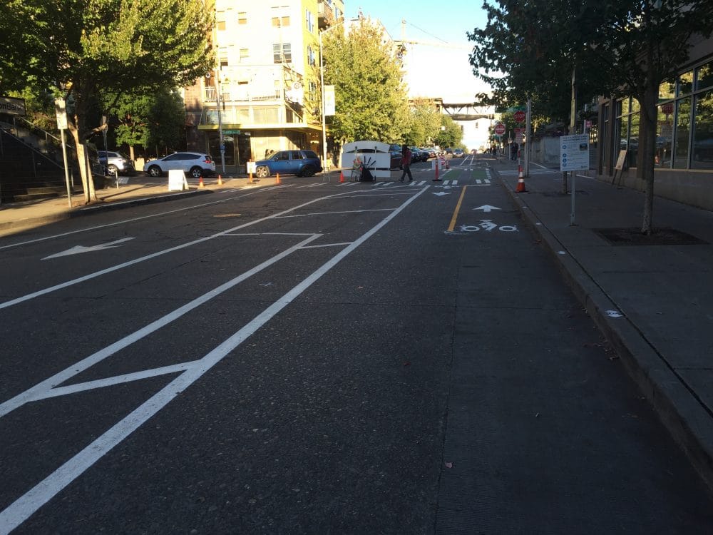 What the street looks like toward Evanston Ave N; note the one-way for motorized vehicles and parking areas.
