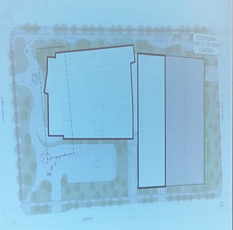 The parking structure is smaller, being replaced by a fenced motor court. (City of Seattle)