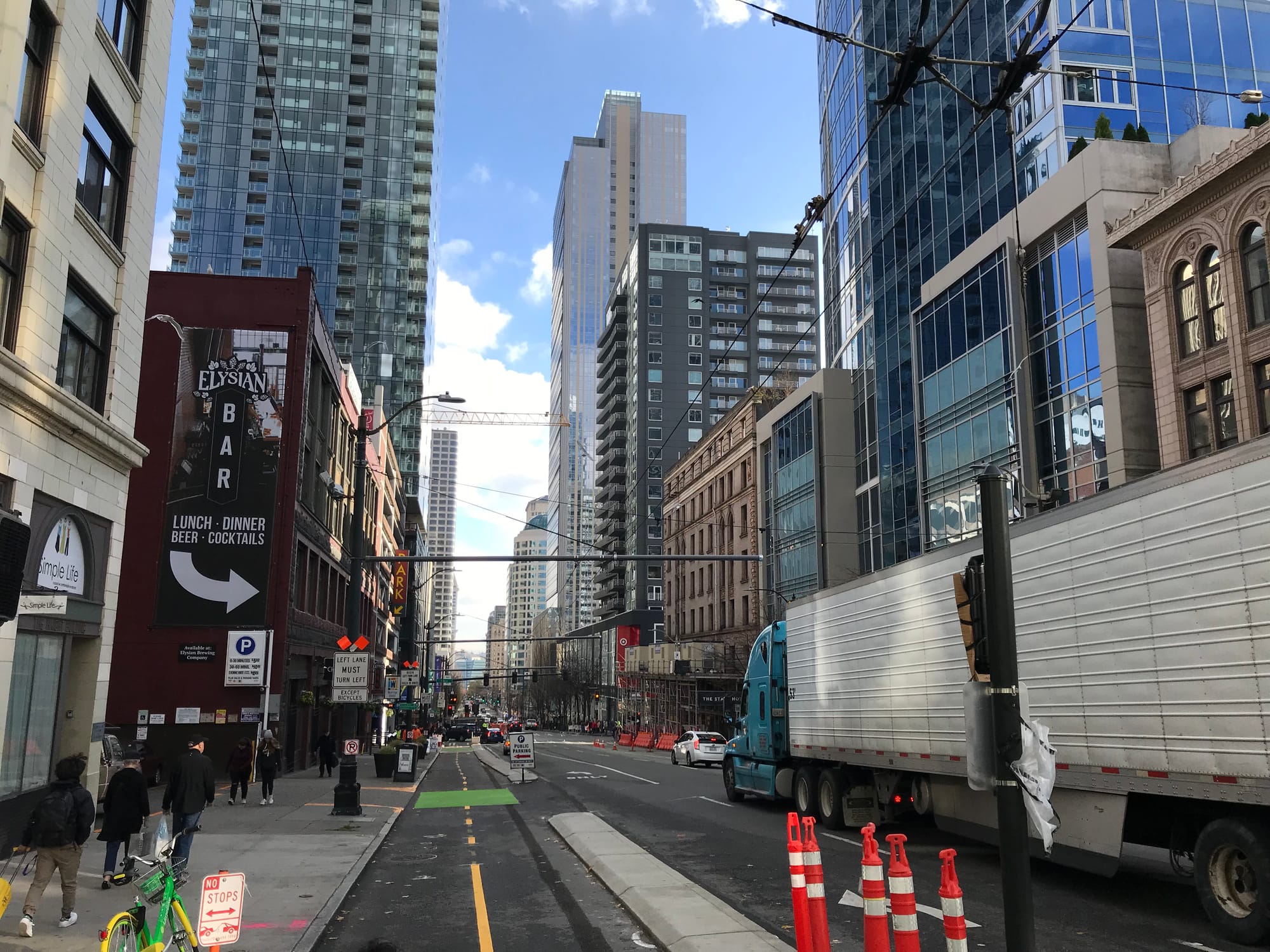 Concrete barrier providing separation from cycletrack and motorized vehicle lanes on Second Avenue. 