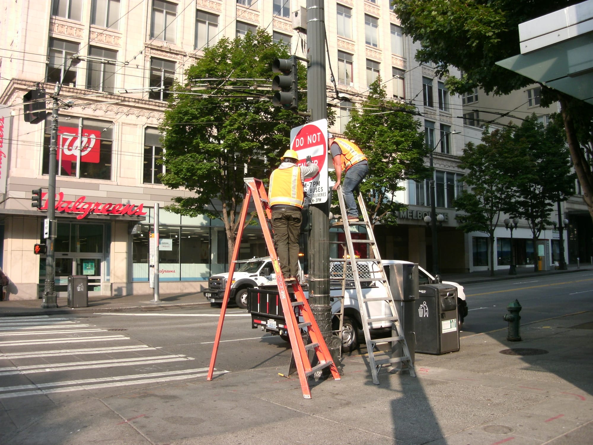 Crews install Do Not Enter signs on 3rd Avenue over the weekend, moving up a planned installation date of September. (Ryan Packer)