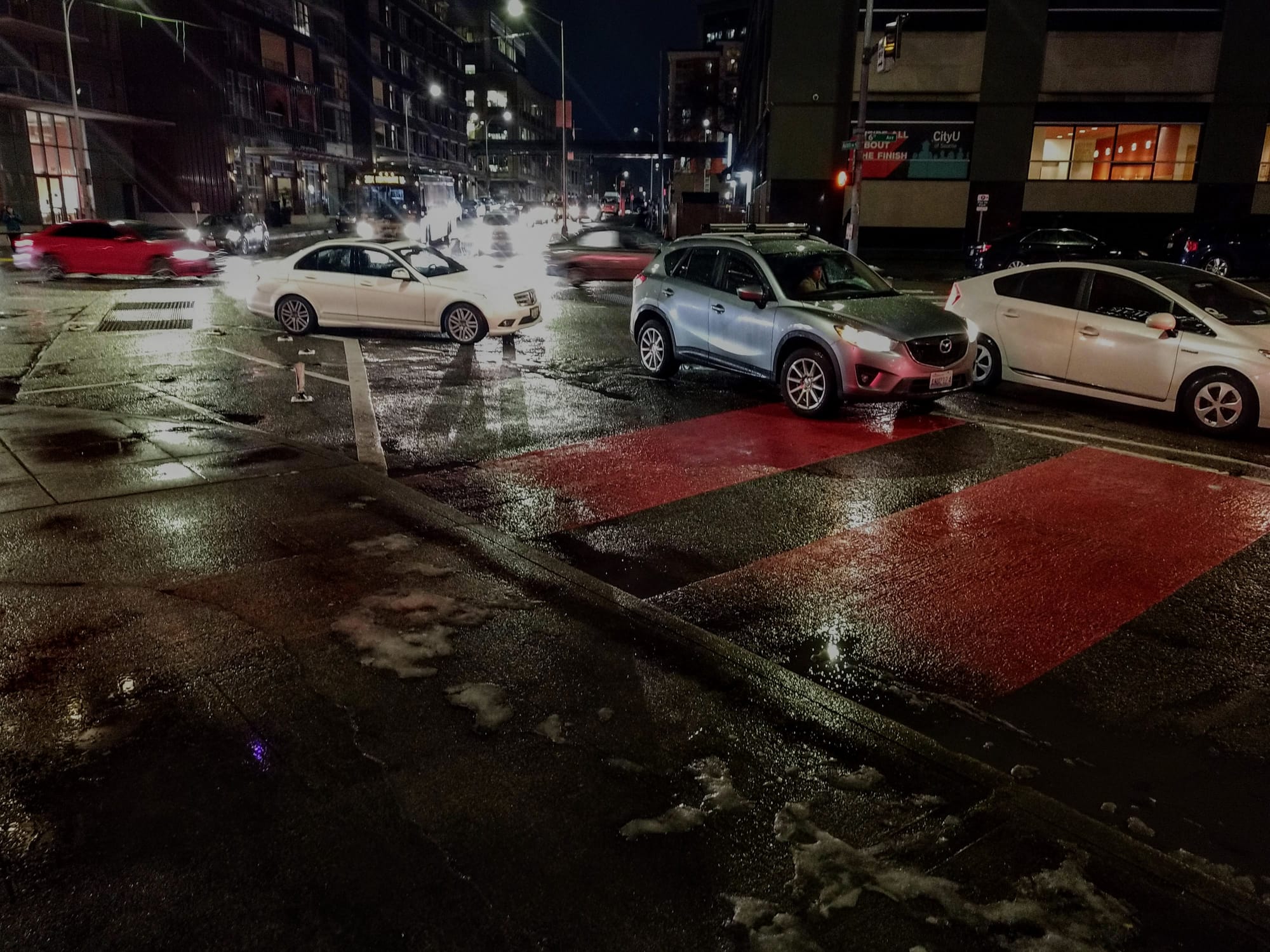 Clogging bus lanes is one way ridehailing cannibalizes transit ridership. (Photo by Doug Trumm)