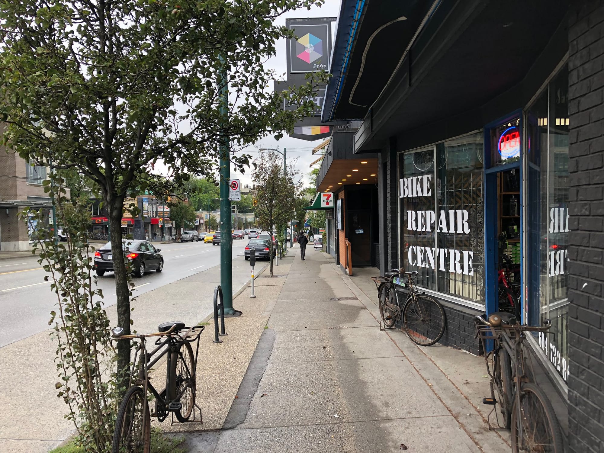 Mount Pleasant features a six-lane BC Highway 7 bisecting the neighborhood with adequate sidewalks, storefronts and biking facilities. Pedestrians benefit from adequate sidewalks and a tree-lined planting buffer. (Image by the author)