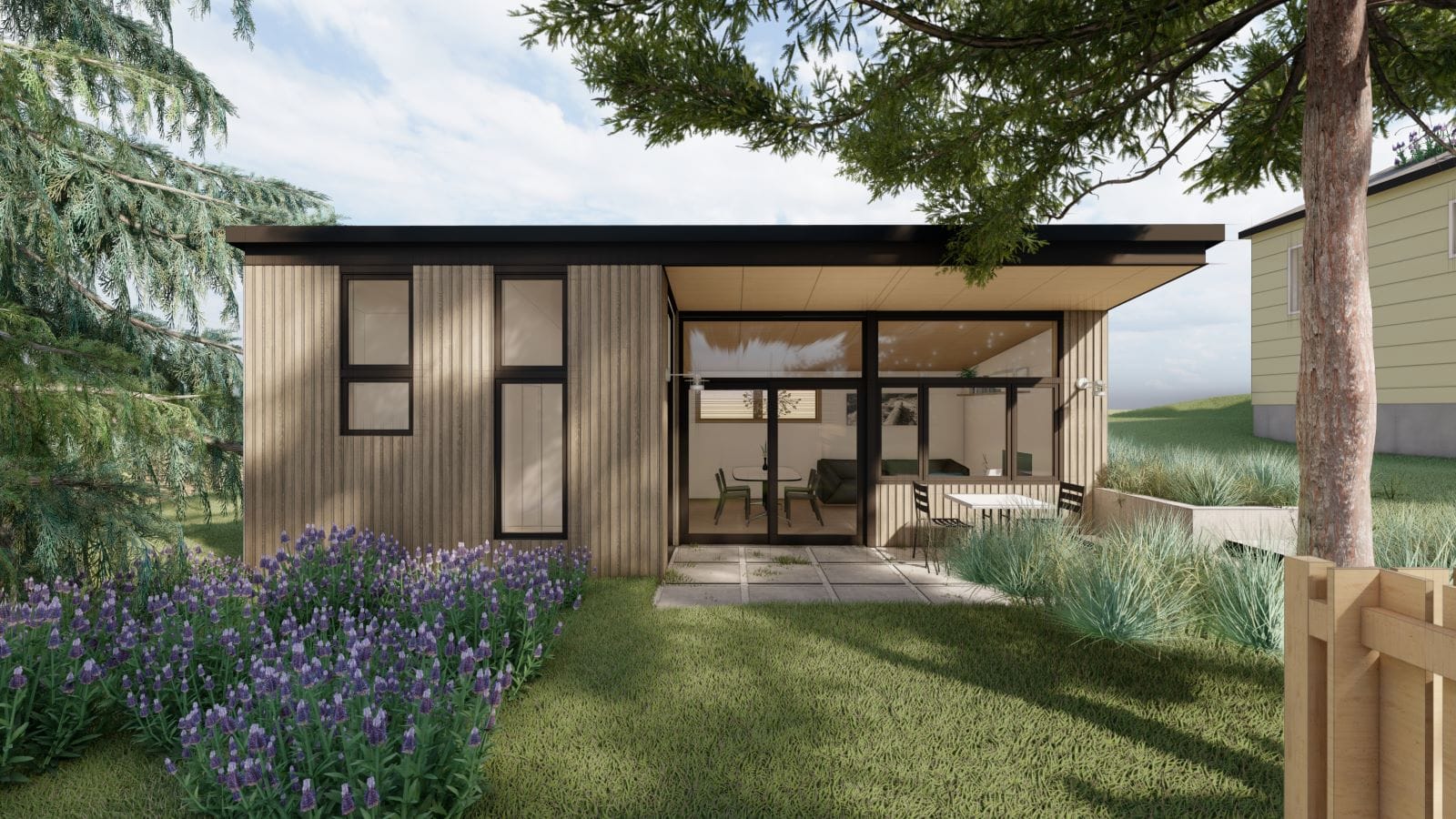 A flat-roof cottage with cedar tree in front yard.