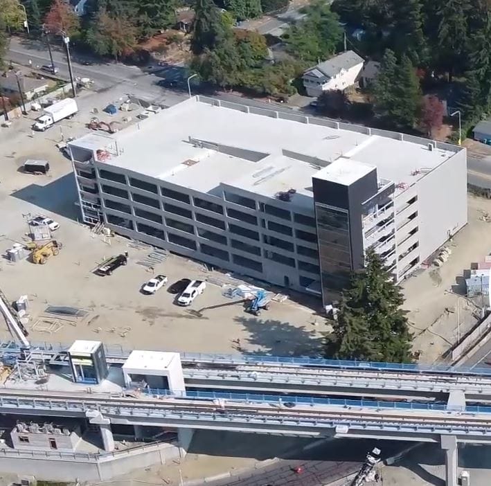 An aerial photo of the light rail station under construction with its brand new parking garage