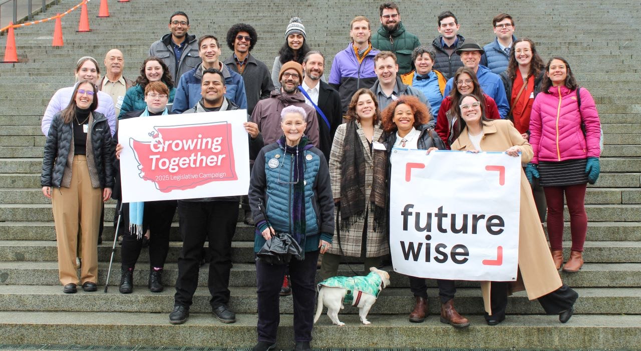 
                     A group of about about 30 advocates stands on the Capitol steps.
                     