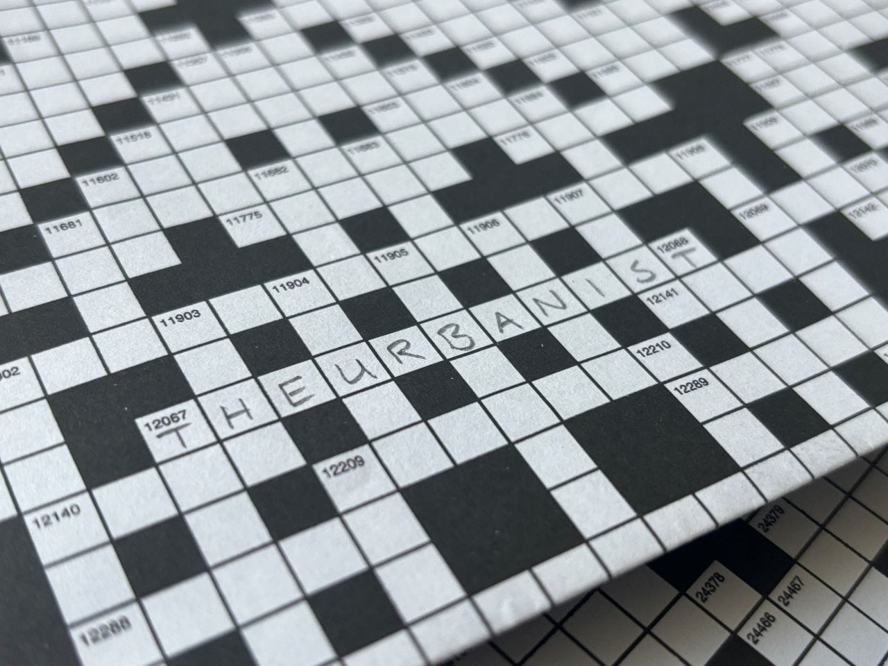 
                     A crossword puzzle with The Urbanist written in for one of the answers.
                     