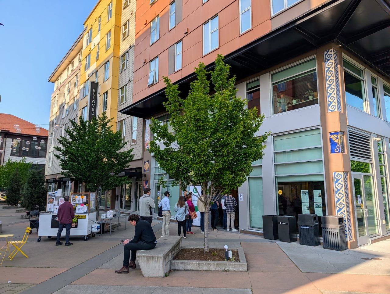 
                     A line forms out the door into the plaza at El Centro de la Raza.
                     