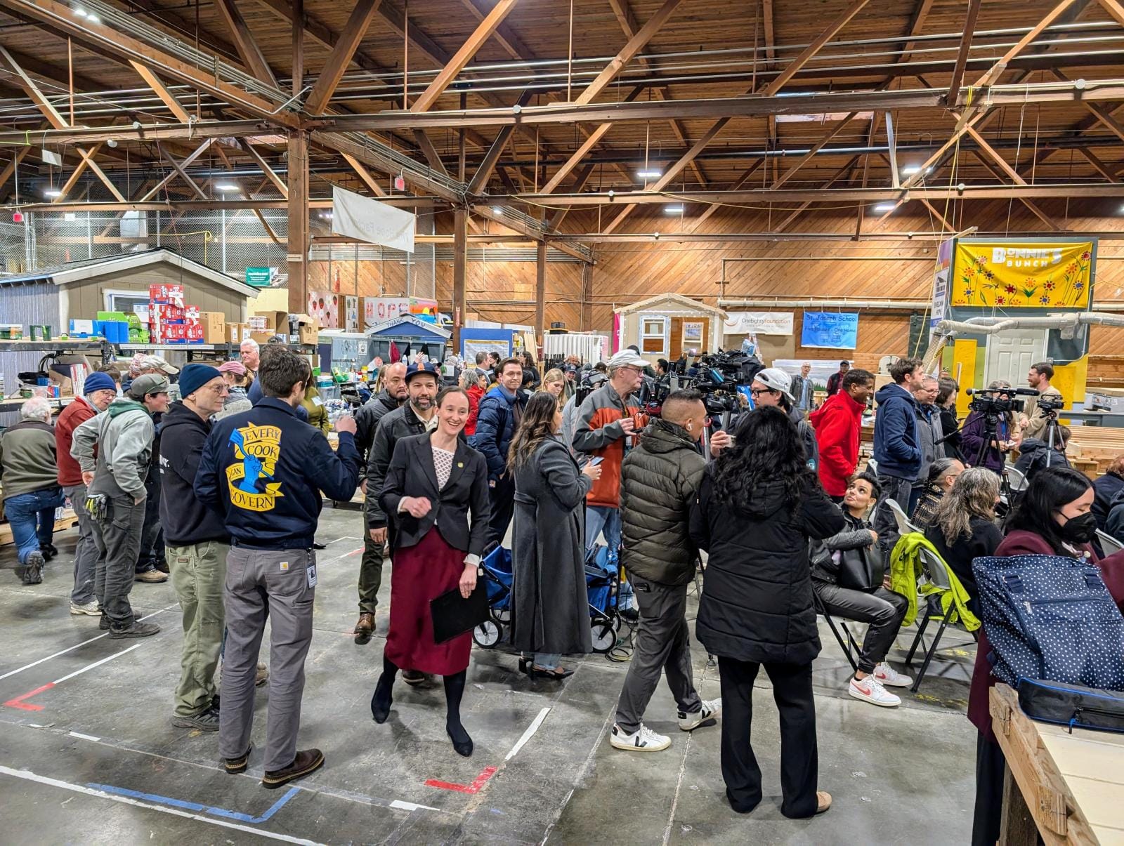 Wilson walks through a crowd with a smile on her face as she heads toward the front of the stage.