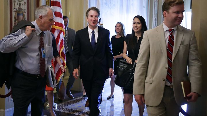 udge Brett Kavanaugh (C), Senator Jon Kyl (L) and others leave a meeting at the U.S. Capitol.