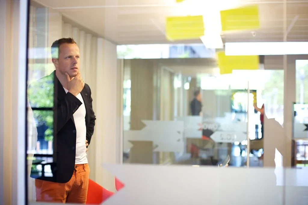 man in the office with a thoughtful face
