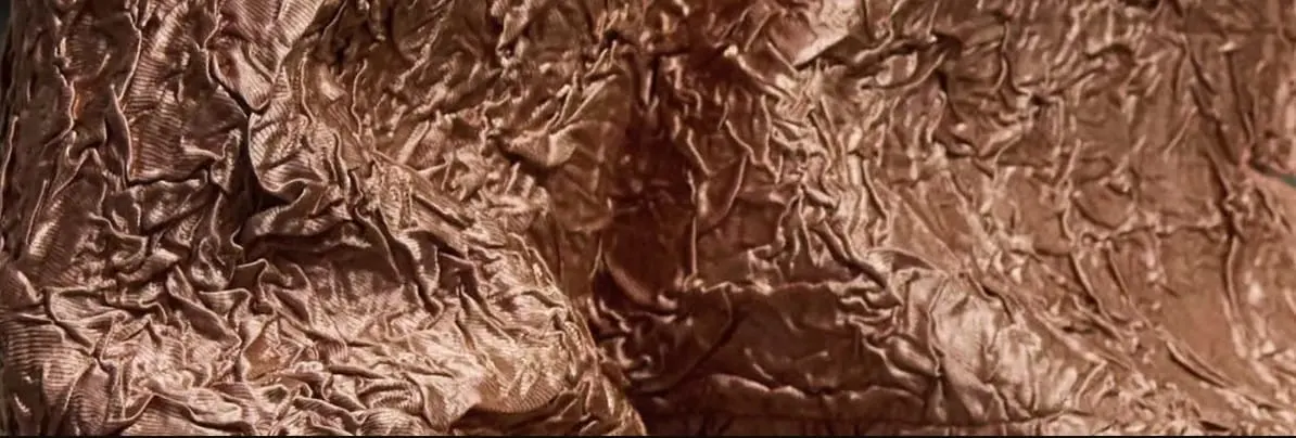 Brown textured surface with folds and creases