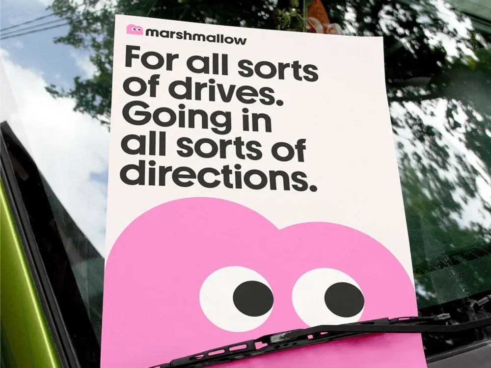 Marshmallow ad on windshield, pink with googly eyes
