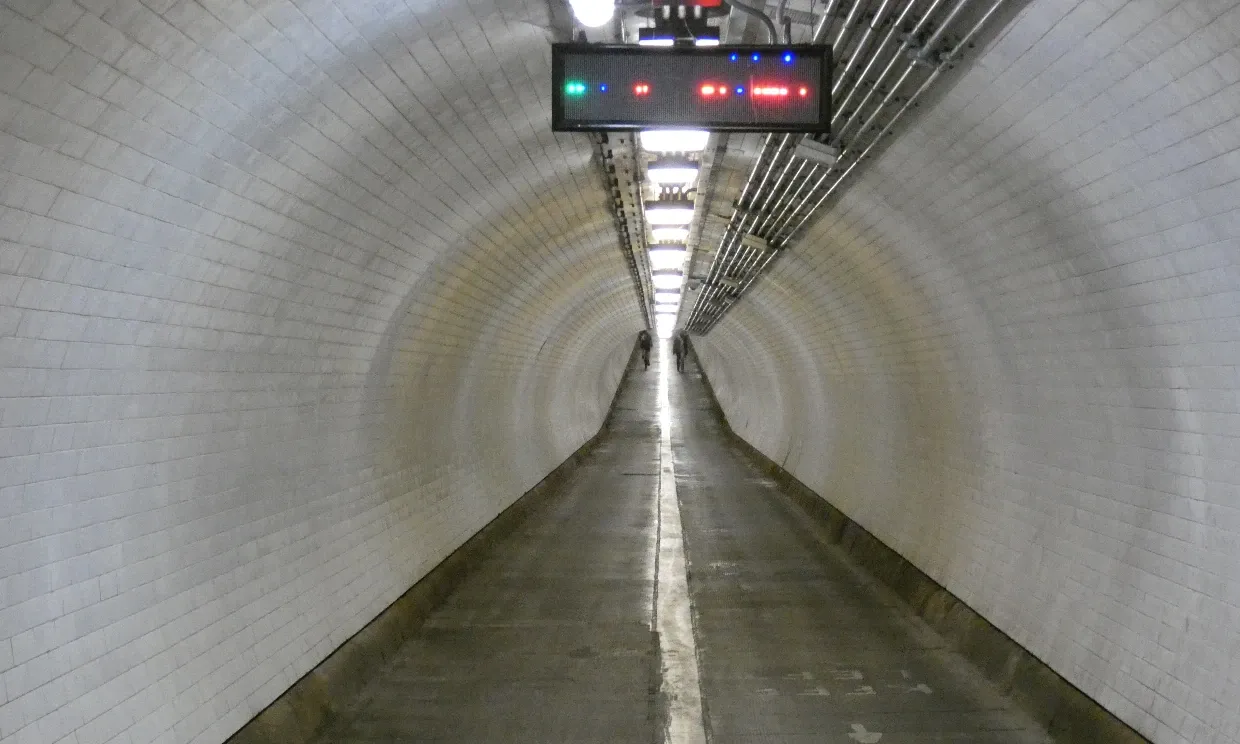 Woolwich foot tunnel interior, a long white tunnel