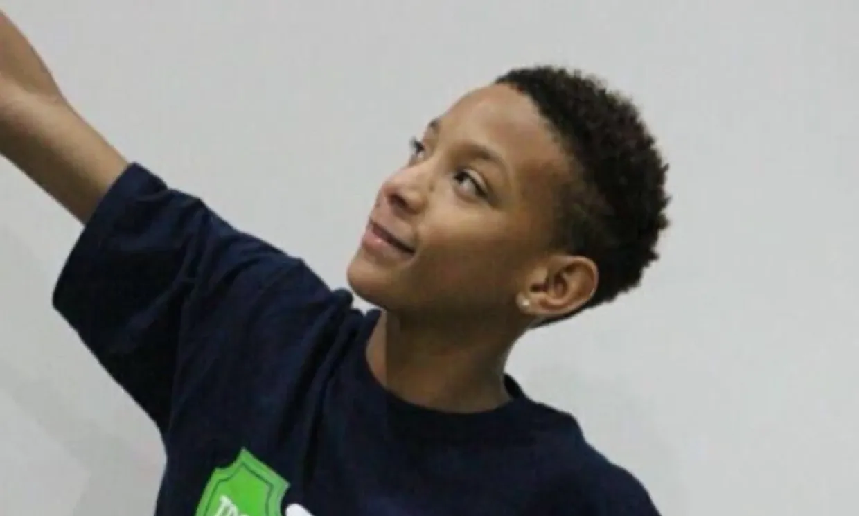 A young boy smiling
