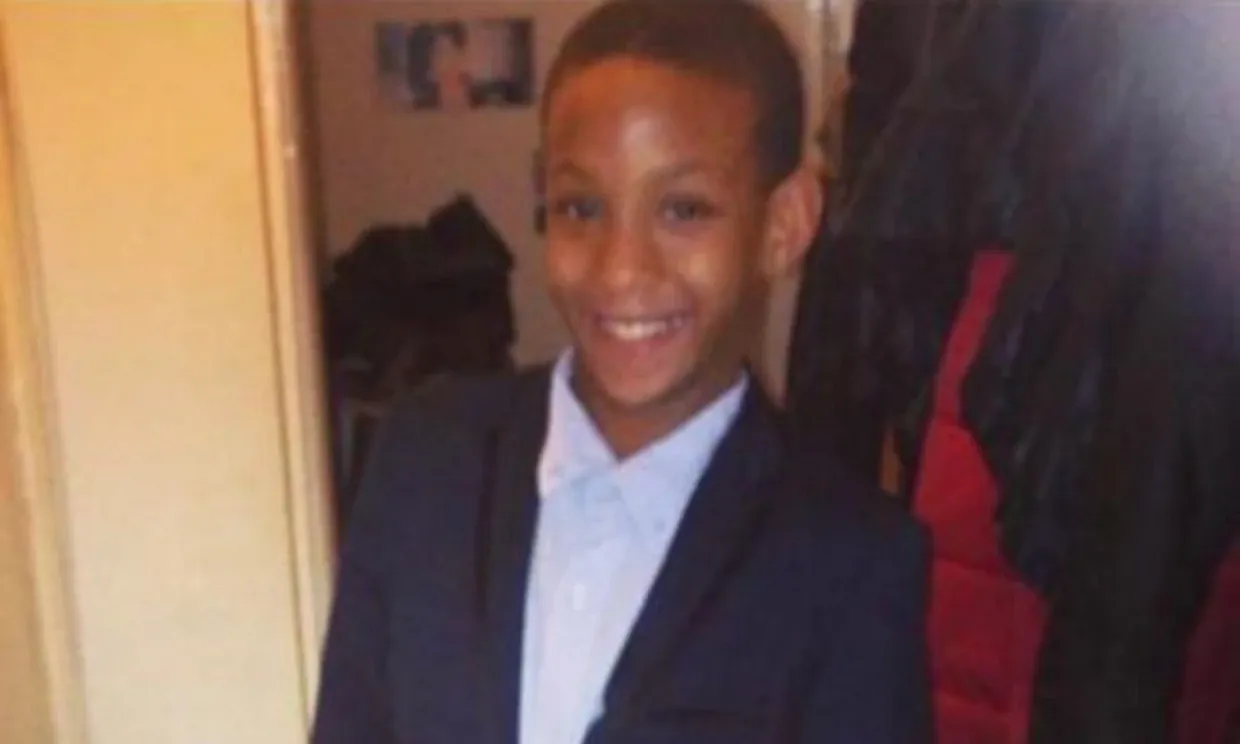 A young boy smiling