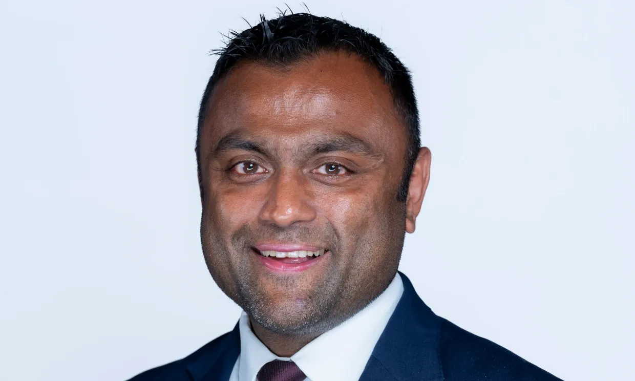 A close up shot of Forhad Hussain smiling to camera