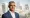 Sadiq Khan standing in front of the London skyline