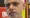 Close up of Sadiq Khan's face, talking to a reporter