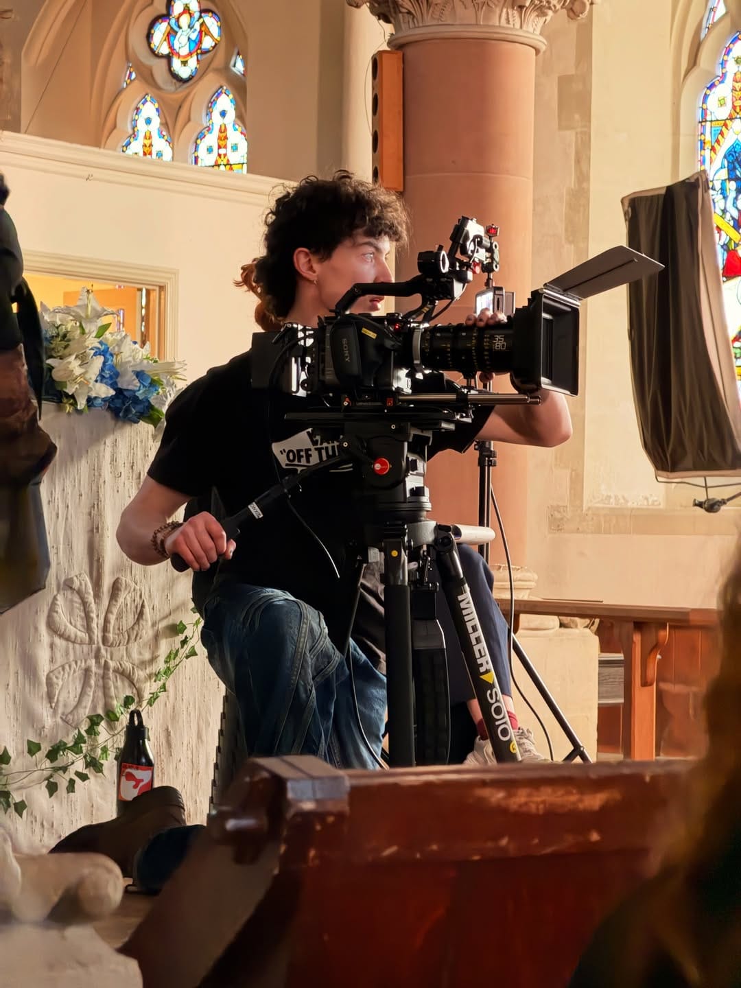 A camera operator in a church.
