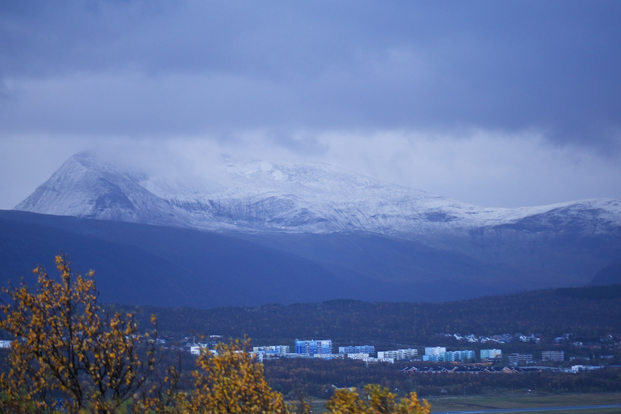 Heavy clouds, wind, yellow trees and a dusting of snow up high. Summer is truly over now.