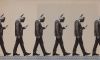 Men with thumbs for head walking with phones.
