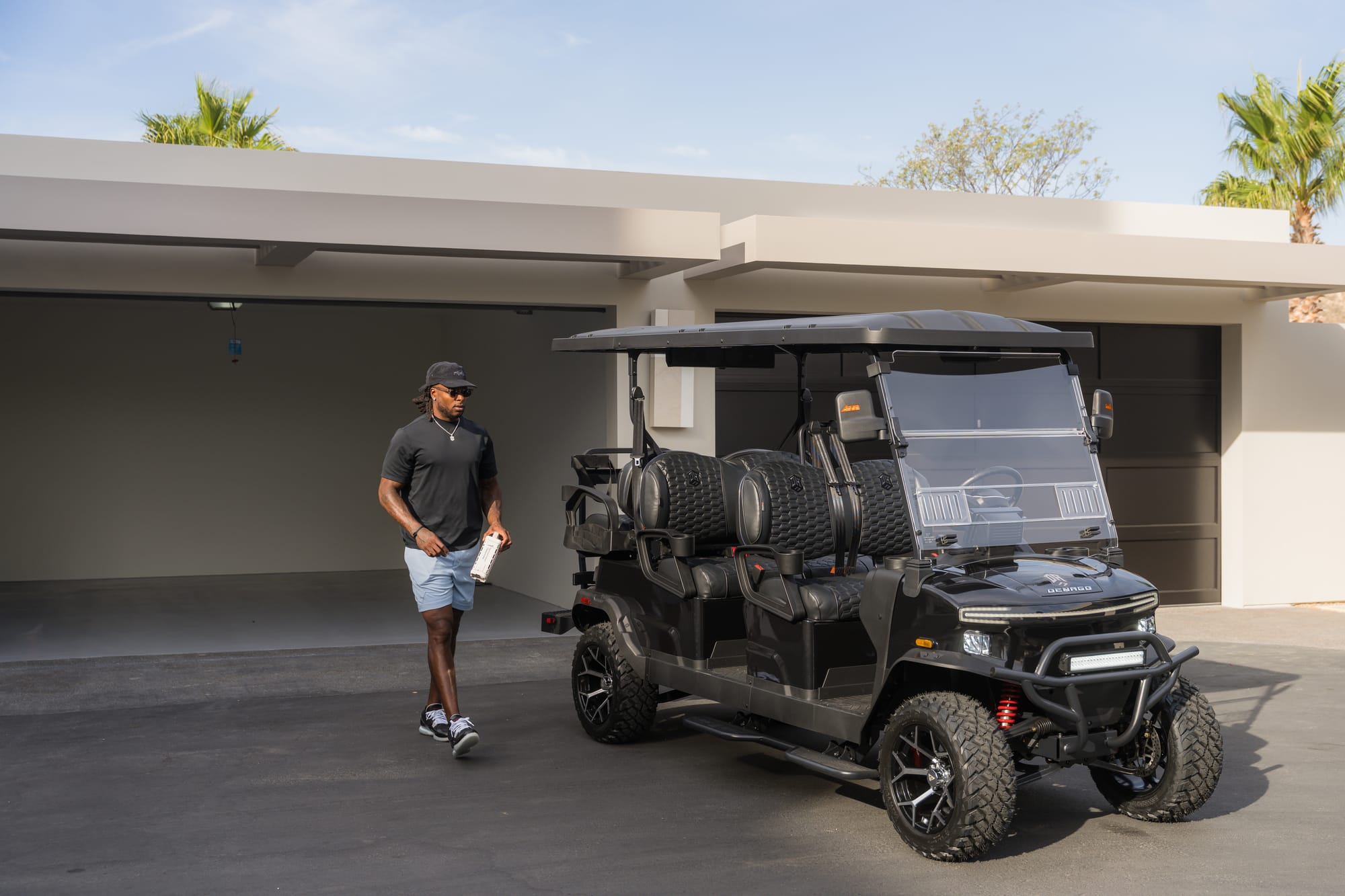 Davante Adams walking toward his Denago Rover XL6