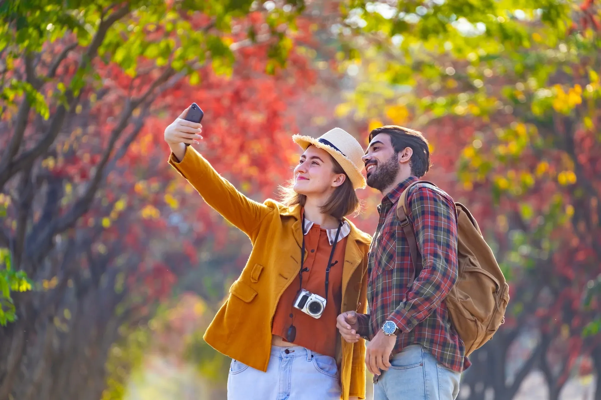Two people taking a selfie in the park