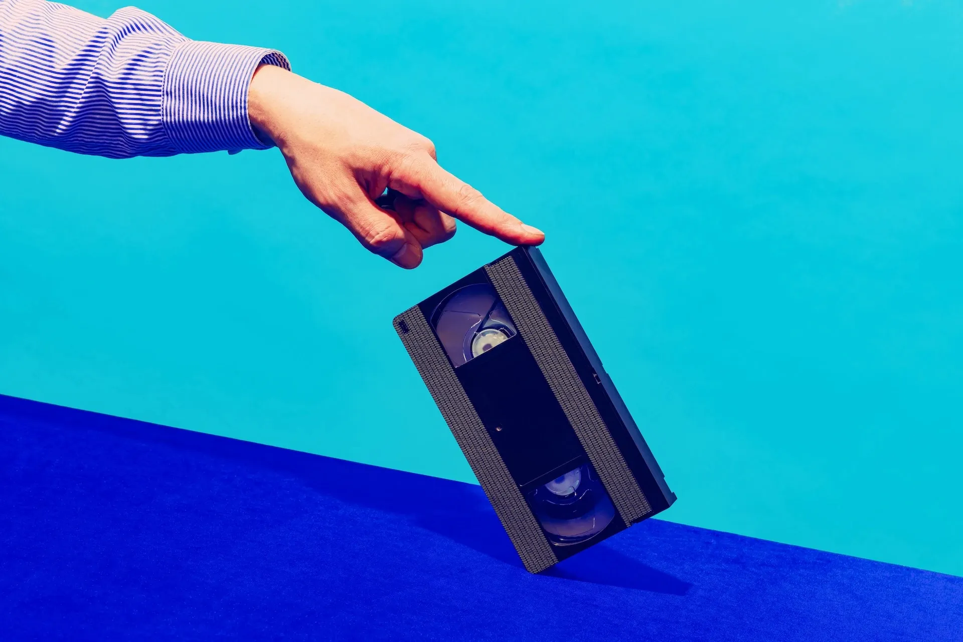 Balancing a VHS tape on a table