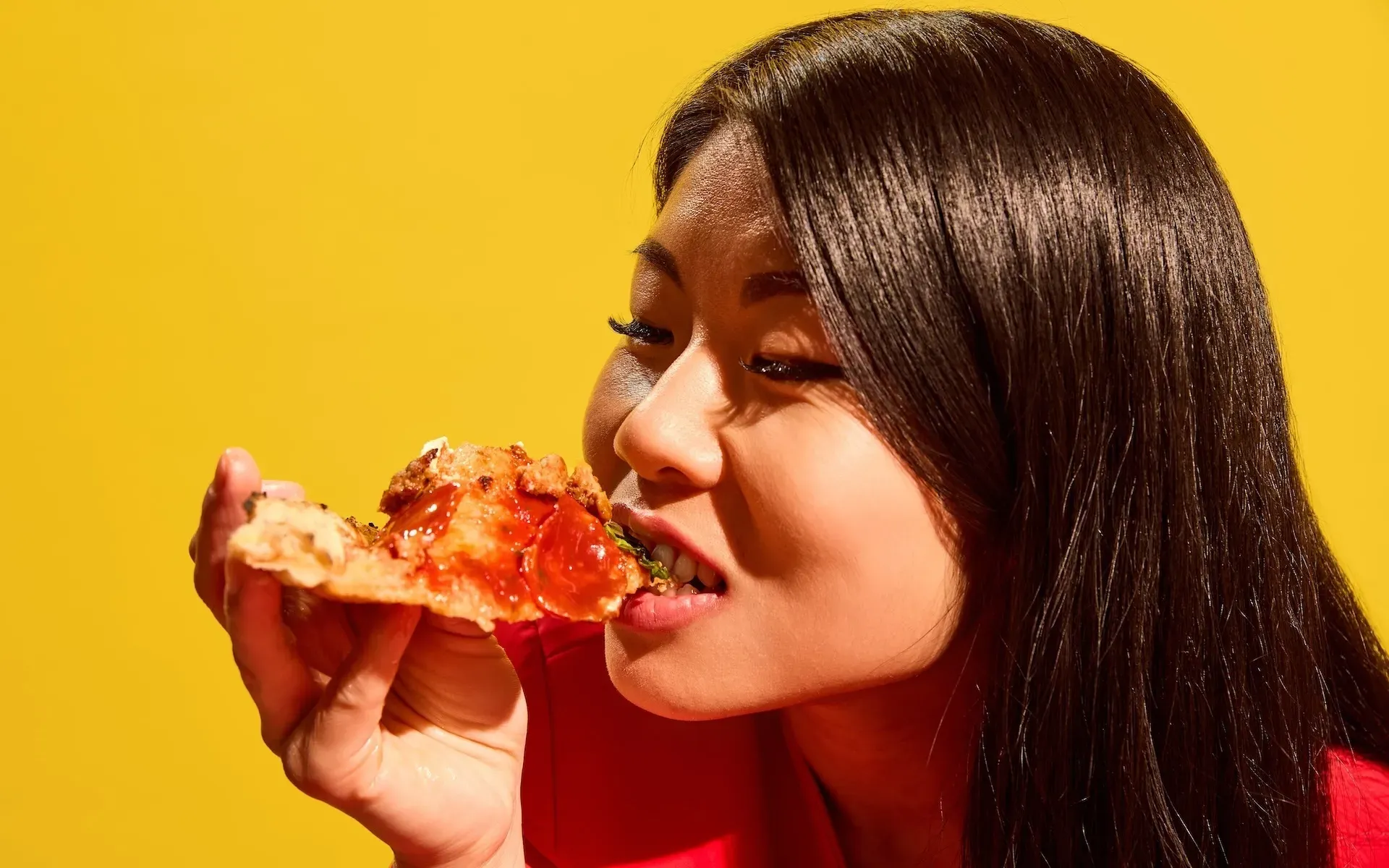 Woman eating pizza